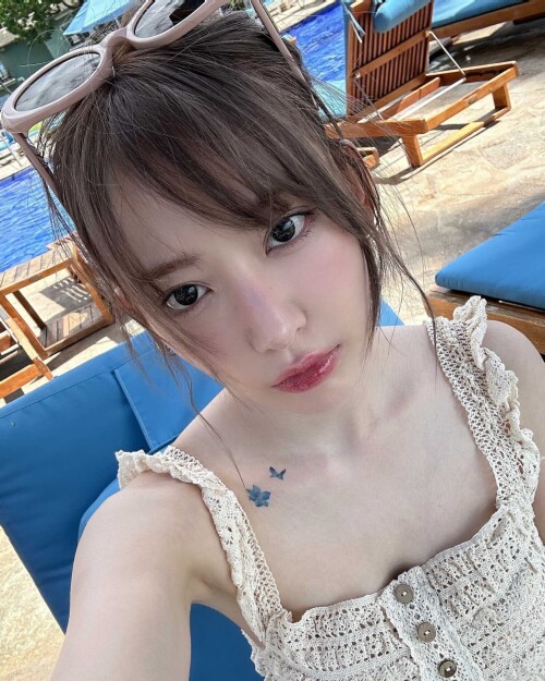 Photo by Sakura Miyawaki on September 24, 2024. May be an image of 1 person, hair, pool and text