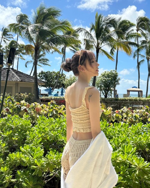 Photo by Sakura Miyawaki on September 24, 2024. May be an image of 1 person, shawl, sarong, sundress