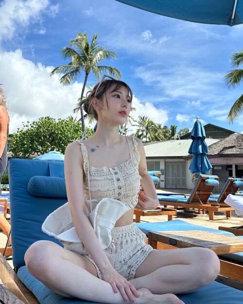 Photo by Sakura Miyawaki on September 24, 2024. May be an image of 1 person, sleepwear, sarong, dres