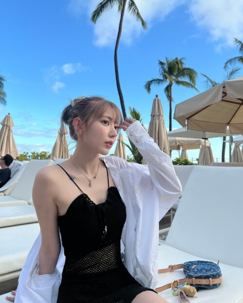 Photo by Sakura Miyawaki on September 24, 2024. May be an image of 2 people, hair and pool