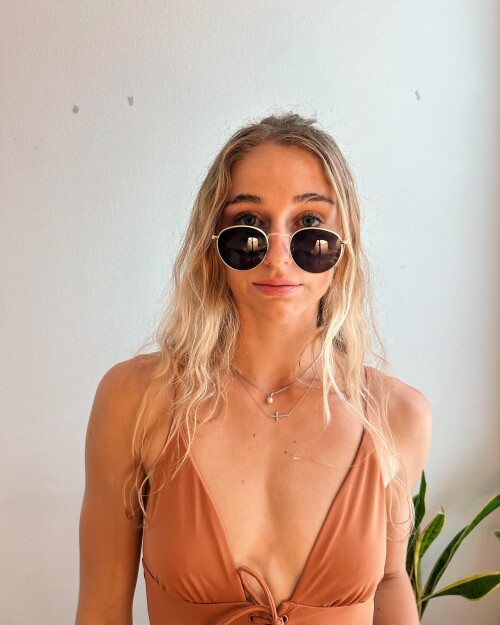 Photo-by-siena-palicke-on-May-08-2024.-May-be-an-image-of-1-person-blonde-hair-halter-top-and-sunglasses.6b0c442585238b68.jpg